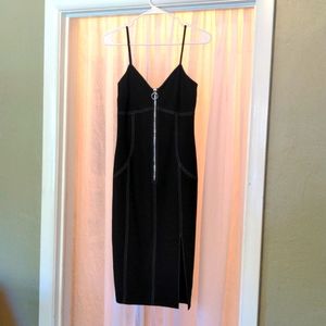 Like new black Marciano spaghetti strap dress with contrast stitching. Size 2.